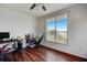 Bedroom with hardwood floors, a large window with a view, and desk/workstation at 4802 51 W St # 1017, Bradenton, FL 34210