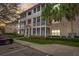 Charming condo exterior with multiple screened-in balconies and lush landscaping at 4802 51 W St # 1017, Bradenton, FL 34210