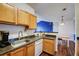 The kitchen features wood cabinets, countertop space, and stainless steel appliances at 4802 51 W St # 1017, Bradenton, FL 34210