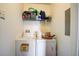 Functional laundry room includes shelving and washer/dryer, offering convenience at 4802 51 W St # 1017, Bradenton, FL 34210