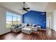 Bright living room featuring a large window, hardwood floors, and comfortable seating at 4802 51 W St # 1017, Bradenton, FL 34210