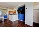 Cozy living room with a large mounted TV, hardwood floors, and open concept design at 4802 51 W St # 1017, Bradenton, FL 34210