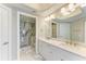 Modern bathroom with double sinks, stylish lighting, and a sleek glass shower at 501 Haben Blvd # 204, Palmetto, FL 34221