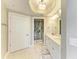 Elegant bathroom featuring a double vanity and frameless glass shower at 501 Haben Blvd # 204, Palmetto, FL 34221