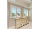 Bedroom dresser with plantation shutters offering privacy and natural light at 501 Haben Blvd # 204, Palmetto, FL 34221