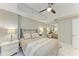 Comfortable bedroom features a ceiling fan and a mirrored closet, complemented by marble floors at 501 Haben Blvd # 204, Palmetto, FL 34221