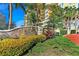 Stone entrance signage for The Palms at Riviera Dunes with colorful landscaping and brick-paved driveway at 501 Haben Blvd # 204, Palmetto, FL 34221