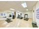 Well-equipped fitness center with modern exercise equipment, mirrors, and workout guides at 501 Haben Blvd # 204, Palmetto, FL 34221