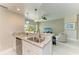 Well-equipped kitchen with granite countertops, stainless steel appliances, and open flow to the living room and balcony at 501 Haben Blvd # 204, Palmetto, FL 34221