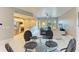 Bright living room featuring modern furnishings, sleek ceiling fan, and a balcony with sliding glass doors at 501 Haben Blvd # 204, Palmetto, FL 34221