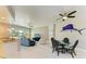 Open-concept living area with balcony access, modern furnishings, and a spacious design for comfortable living at 501 Haben Blvd # 204, Palmetto, FL 34221