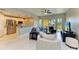Cozy living room seamlessly connects the kitchen, living area, and balcony, creating an inviting atmosphere at 501 Haben Blvd # 204, Palmetto, FL 34221
