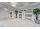 Clean lobby area features tiled flooring, plants, elevators, and neutral decor for a welcoming atmosphere at 501 Haben Blvd # 204, Palmetto, FL 34221