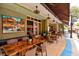 Inviting outdoor dining area with comfortable seating and shaded ambiance at 501 Haben Blvd # 204, Palmetto, FL 34221