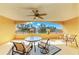 Covered outdoor patio with comfortable seating and view of scenic landscaped fountain at 501 Haben Blvd # 204, Palmetto, FL 34221