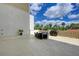 Spacious outdoor patio perfect for dining with a BBQ grill and tropical landscaping view at 501 Haben Blvd # 204, Palmetto, FL 34221