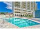 Exterior shot showcasing the pool and multiple story condominium building at 501 Haben Blvd # 204, Palmetto, FL 34221