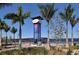 Vibrant Riverwalk sign with palm trees, a bridge, and waterfront views, inviting visitors to explore the area at 501 Haben Blvd # 204, Palmetto, FL 34221