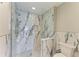 Bathroom with a frameless shower and marble-style tiling at 501 Haben Blvd # 204, Palmetto, FL 34221