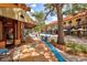 Charming street view featuring outdoor seating, storefronts, and colorful architecture at 501 Haben Blvd # 204, Palmetto, FL 34221