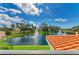 Beautiful view from the balcony overlooking a pond with fountains and lush landscaping at 501 Haben Blvd # 204, Palmetto, FL 34221