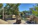 Outdoor seating area with a fire pit on a wooden deck offering views of the waterfront at 514 Ralph St, Sarasota, FL 34242