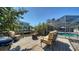Inviting back deck area with comfortable seating, a fire pit and relaxing views of the canal and pool at 514 Ralph St, Sarasota, FL 34242