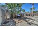 Backyard area with a wooden fence and gravel ground, providing a simple outdoor space at 514 Ralph St, Sarasota, FL 34242