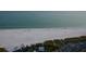 Beautiful coastal scenery of a white sand beach with turquoise water, showcasing the waterfront location at 514 Ralph St, Sarasota, FL 34242