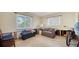 Bedroom with a large window offering a view, a sofa, and ample space at 514 Ralph St, Sarasota, FL 34242
