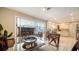 Bright dining room with tile floors, large sliding doors, and seamless access to both the kitchen and the living room at 514 Ralph St, Sarasota, FL 34242