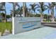 Welcome to Siesta Beach, a Sarasota County Park, as indicated by its elegant entrance sign surrounded by swaying palms at 514 Ralph St, Sarasota, FL 34242
