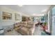 Inviting living room featuring a comfortable seating area, tile floors, and abundant natural light from the sliding doors at 514 Ralph St, Sarasota, FL 34242