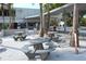 Inviting picnic area at Siesta Beach featuring concrete tables and benches, perfect for Gathering outings and leisurely lunches at 514 Ralph St, Sarasota, FL 34242