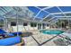 Screened in Pool area featuring a swimming pool and outdoor seating including lounge chairs at 514 Ralph St, Sarasota, FL 34242