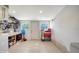 Utility room with ample storage, a counter, and tile flooring at 514 Ralph St, Sarasota, FL 34242