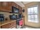 Efficient kitchen featuring updated appliances, ample counter space, and natural light at 5631 Rosehill Rd. Rd # 203, Sarasota, FL 34233