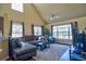 Bright living room with a comfortable seating area, vaulted ceiling, and lots of natural light at 5631 Rosehill Rd. Rd # 203, Sarasota, FL 34233