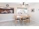 Dining area with views into kitchen and living space at 5688 Lake Vista Ct # 31, Sarasota, FL 34233