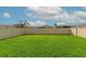 Spacious backyard featuring a well-maintained lawn and privacy fence at 5743 Bungalow Grove Ct, Palmetto, FL 34221