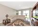 Cozy living room with plush seating, stylish lamps, and sliding glass doors at 5743 Bungalow Grove Ct, Palmetto, FL 34221