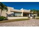 Attractive clubhouse exterior with manicured landscaping and architectural details at 5780 Midnight Pass Rd # 210, Sarasota, FL 34242