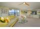 Open concept living room and dining area with bright, neutral tones and sleek furnishings at 5780 Midnight Pass Rd # 210, Sarasota, FL 34242