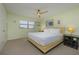 Cozy bedroom with a comfortable bed, neutral colors, and ample natural light at 5780 Midnight Pass Rd # 210, Sarasota, FL 34242