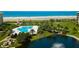 Enjoy a gorgeous beachside view from this property with a pristine pool surrounded by lush landscaping and well-maintained greenery at 5780 Midnight Pass Rd # 210, Sarasota, FL 34242