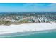 Discover resort-style living with beach access, a pool, and a lake in a beautiful condo community from an aerial view at 5780 Midnight Pass Rd # 210, Sarasota, FL 34242