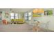 Comfortable living room featuring large windows, stylish furniture and ample natural light at 5780 Midnight Pass Rd # 210, Sarasota, FL 34242