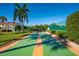 Outdoor shuffleboard court surrounded by well-maintained landscaping, offering a recreational amenity at 5780 Midnight Pass Rd # 210, Sarasota, FL 34242