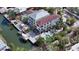 Aerial view showcasing a waterfront property with a pool, dock, and boat, in a serene, tropical setting at 601 Avenida De Mayo, Sarasota, FL 34242