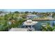 Aerial view featuring boat, boat lift, canal and neighborhood at 601 Avenida De Mayo, Sarasota, FL 34242